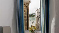 Gaze across the harbour to the ever-changing view.
