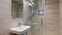The en suite shower has a spa-like feel.