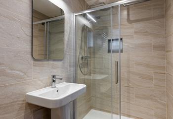 The en suite shower has a spa-like feel.