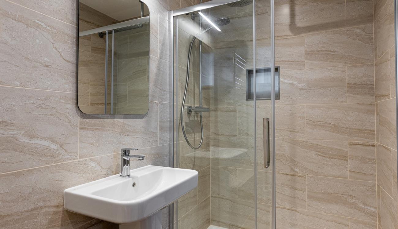 The en suite shower has a spa-like feel.