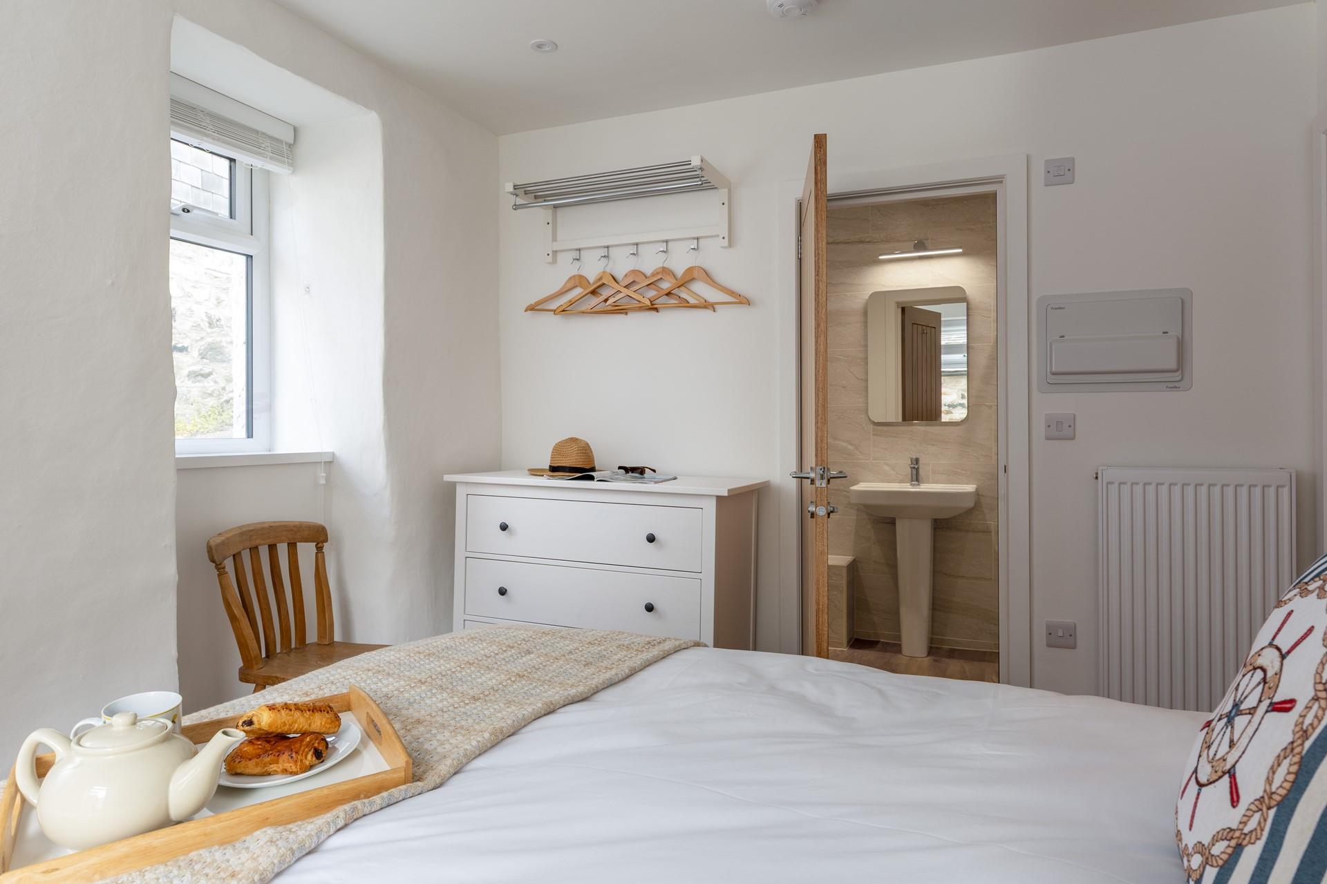 A stylish en suite and plenty of storage space in Bedroom 1.
