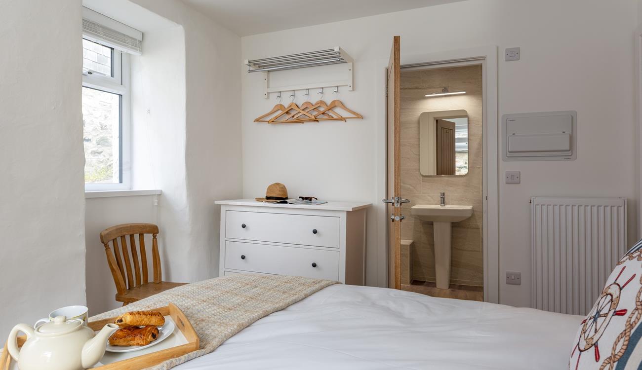 A stylish en suite and plenty of storage space in Bedroom 1.