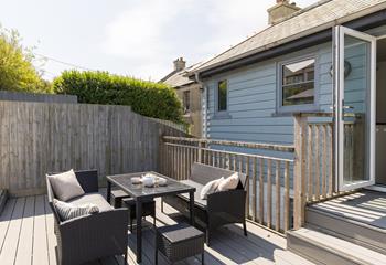 From the kitchen, step out onto the shared decked terrace.