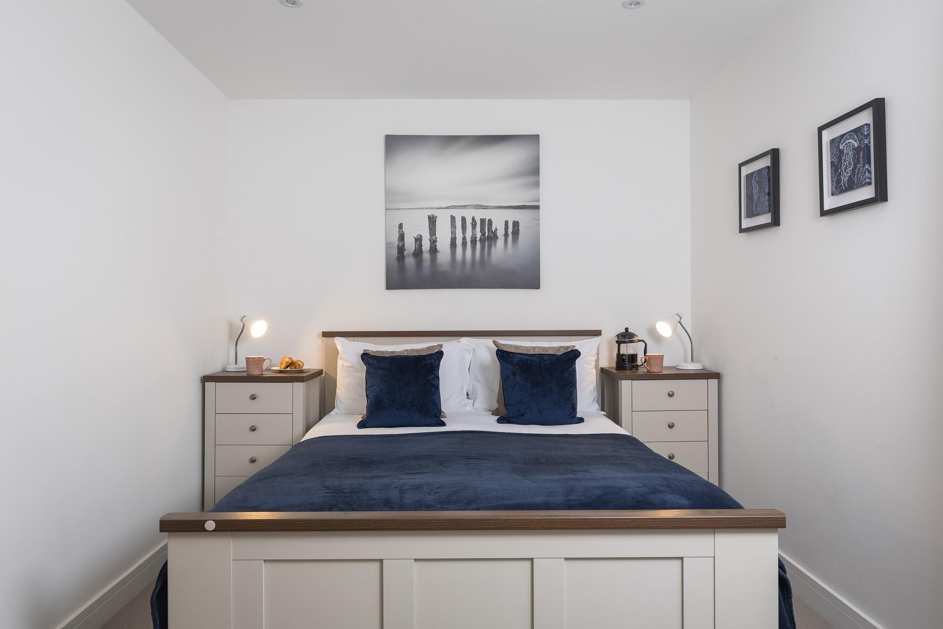 Bedroom 1 is a calming, coastal sanctuary.