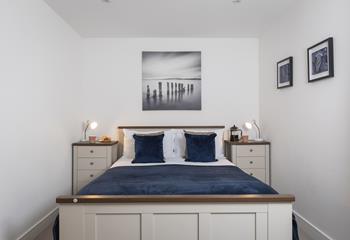 Bedroom 1 is a calming, coastal sanctuary.