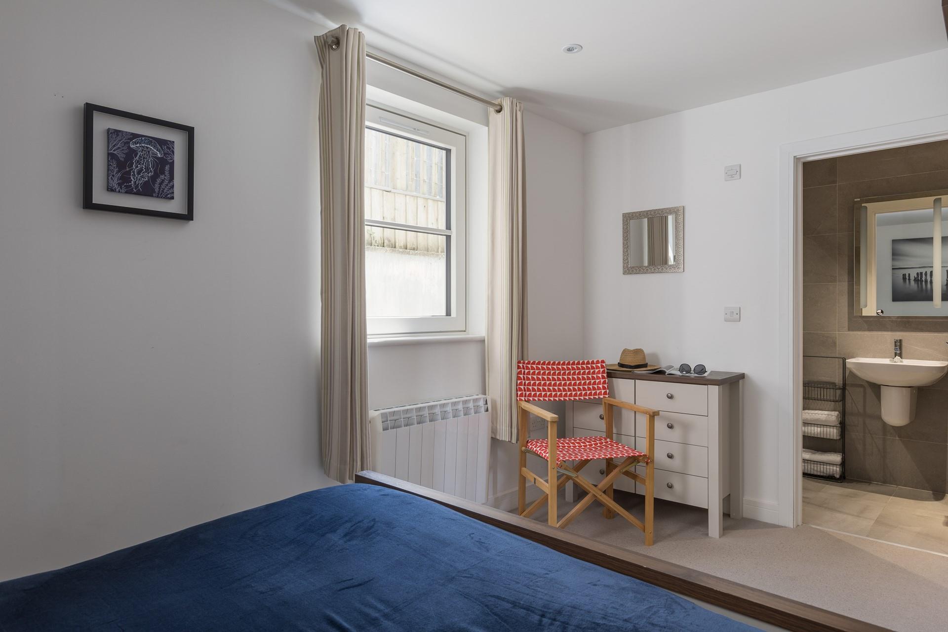Relax in comfort with a king size bed and an en suite shower room.