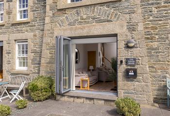 Bi-fold doors open out to make the most of the vista.
