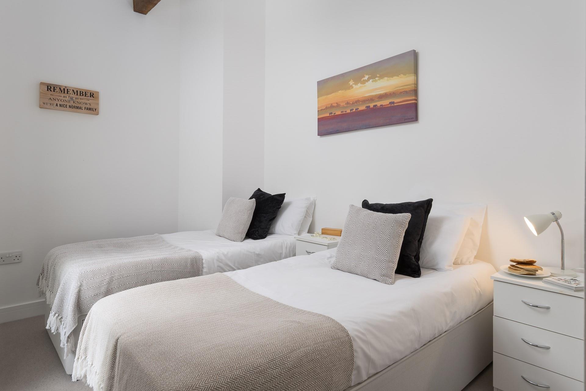 Bedroom 3 has twin beds, suitable for adults and children alike.