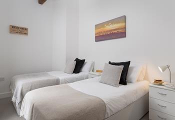 Bedroom 3 has twin beds, suitable for adults and children alike.