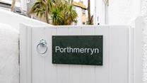 The private entrance is nestled amongst quaint fisherman's cottages.
