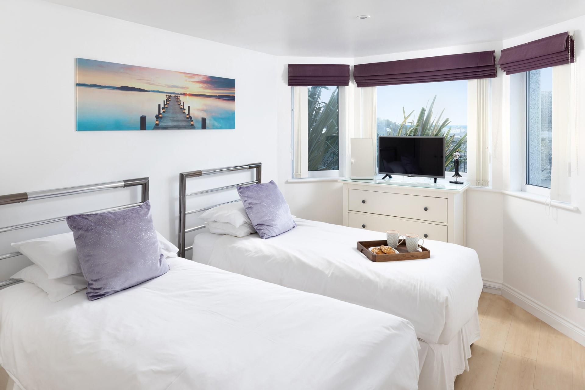 Slide into the sheets in bedroom 1 after a day of adventure.