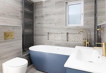 Soak in the tub after a day of exploring the coastal footpaths. 