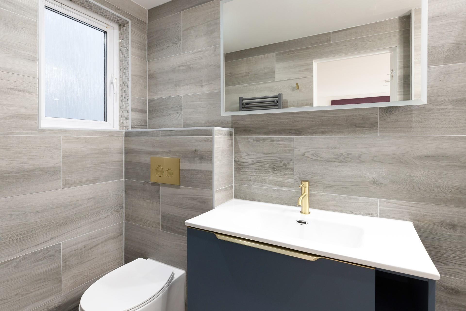 The modern ensuite is the perfect place to get ready for the day. 