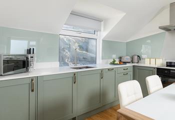 The well-equipped kitchen is the perfect space to whip up your favourite meals. 