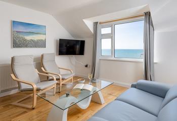 Sink into the sofa and watch the sea roll in beyond the windows. 